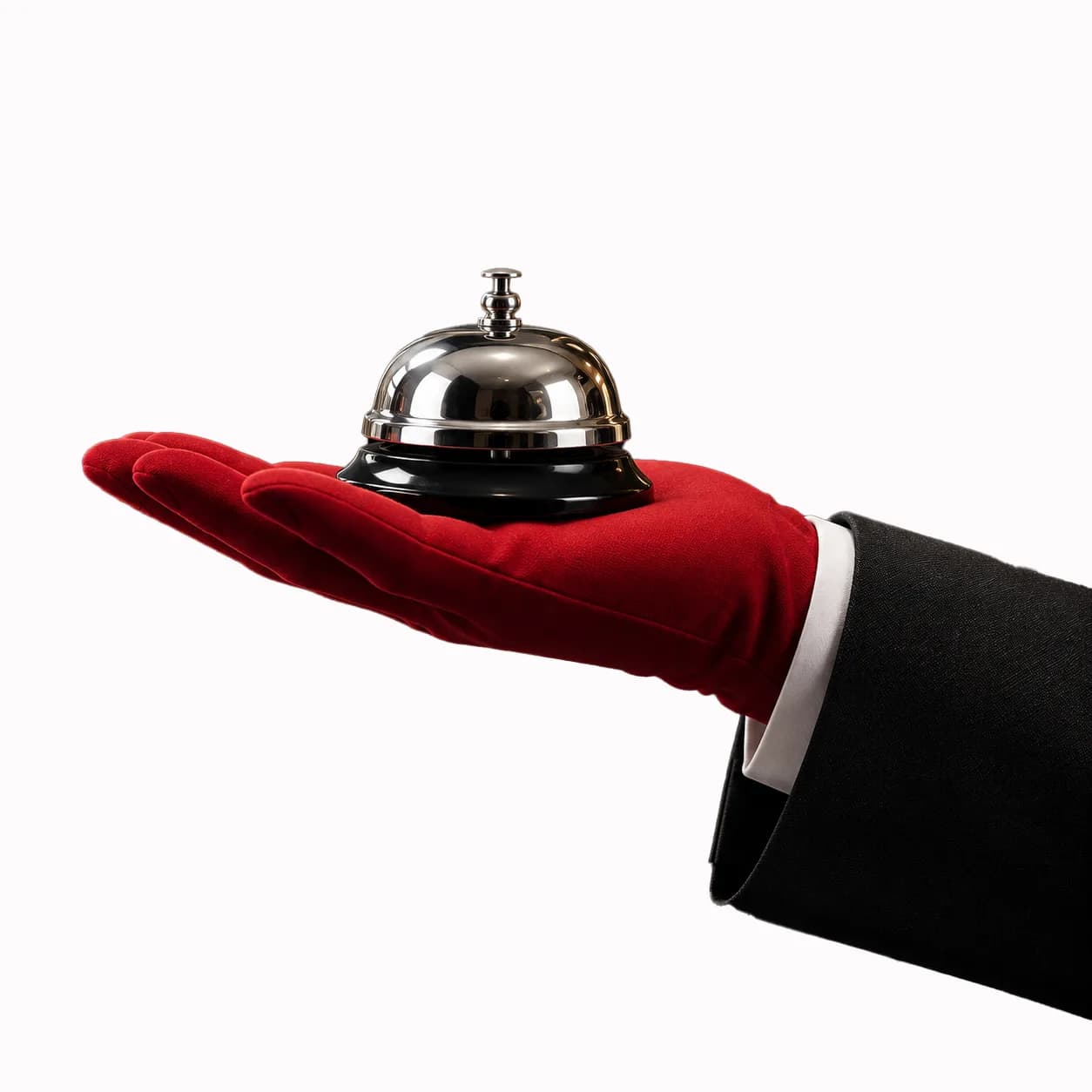 A white-gloved concierge presenting a service bell