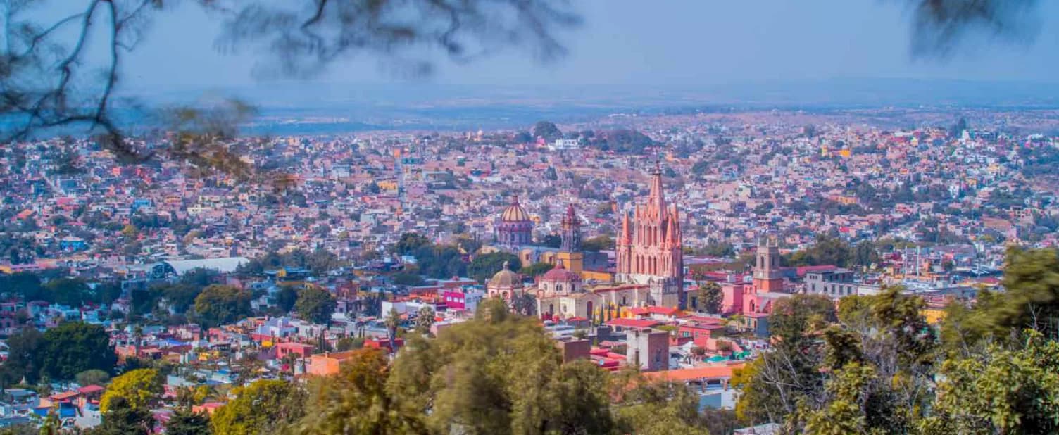 Panoramic view of San Miguel de Allende with the pink Parroquia church rising above the historic center