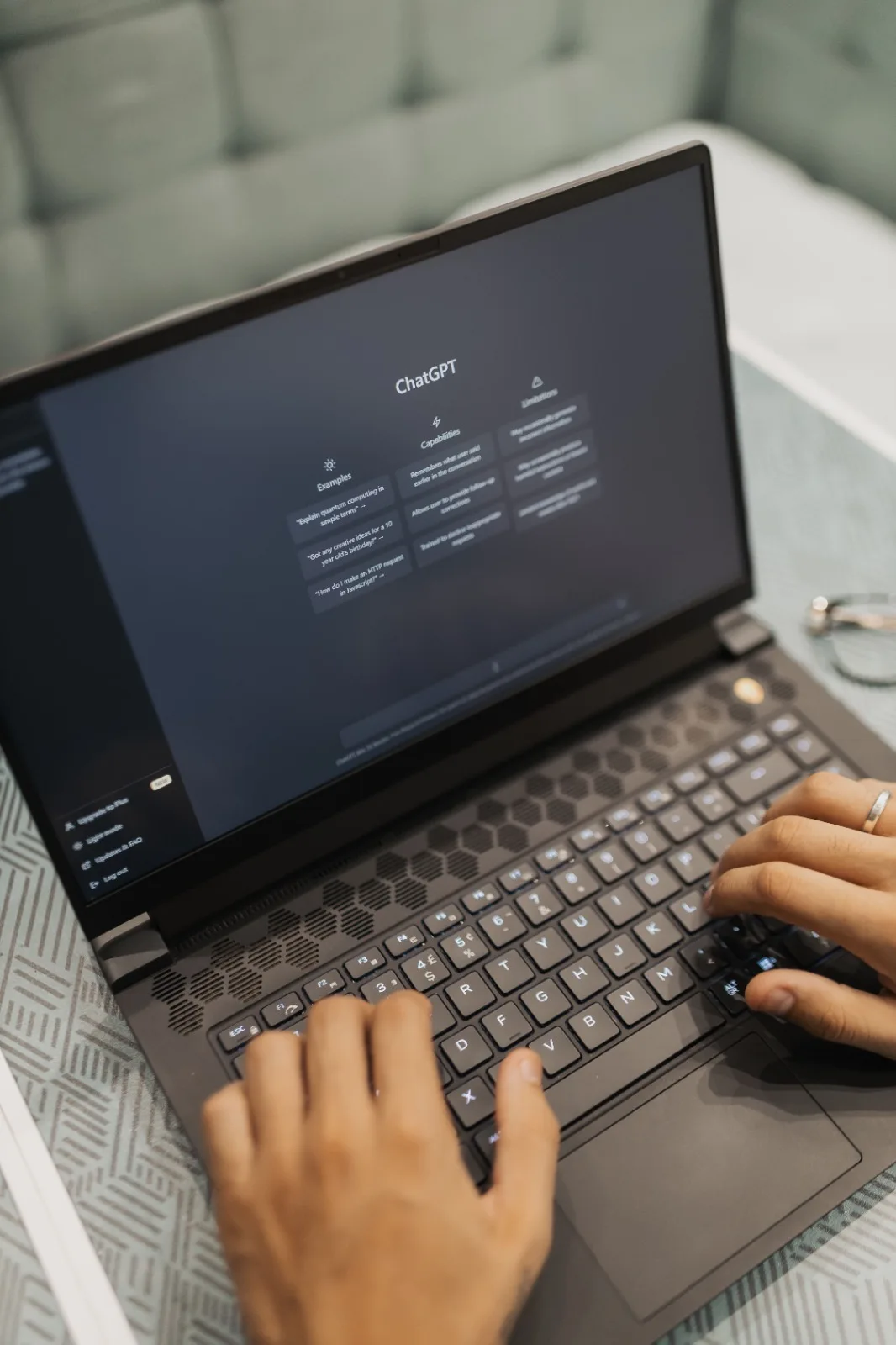 A real estate transaction coordinator working at a laptop